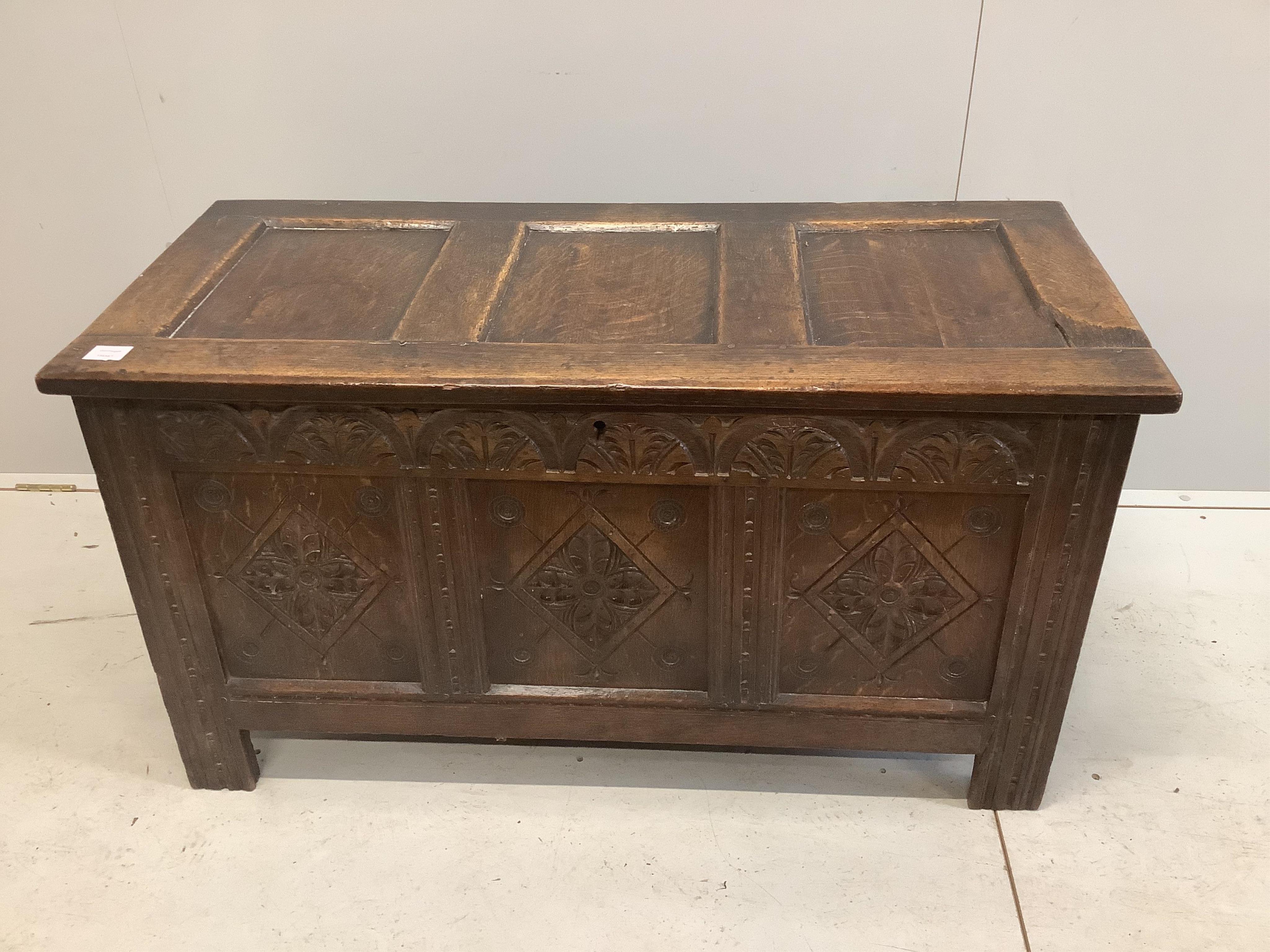 A 17th century carved oak coffer, width 112cm, depth 51cm, height 61cm. Condition - fair